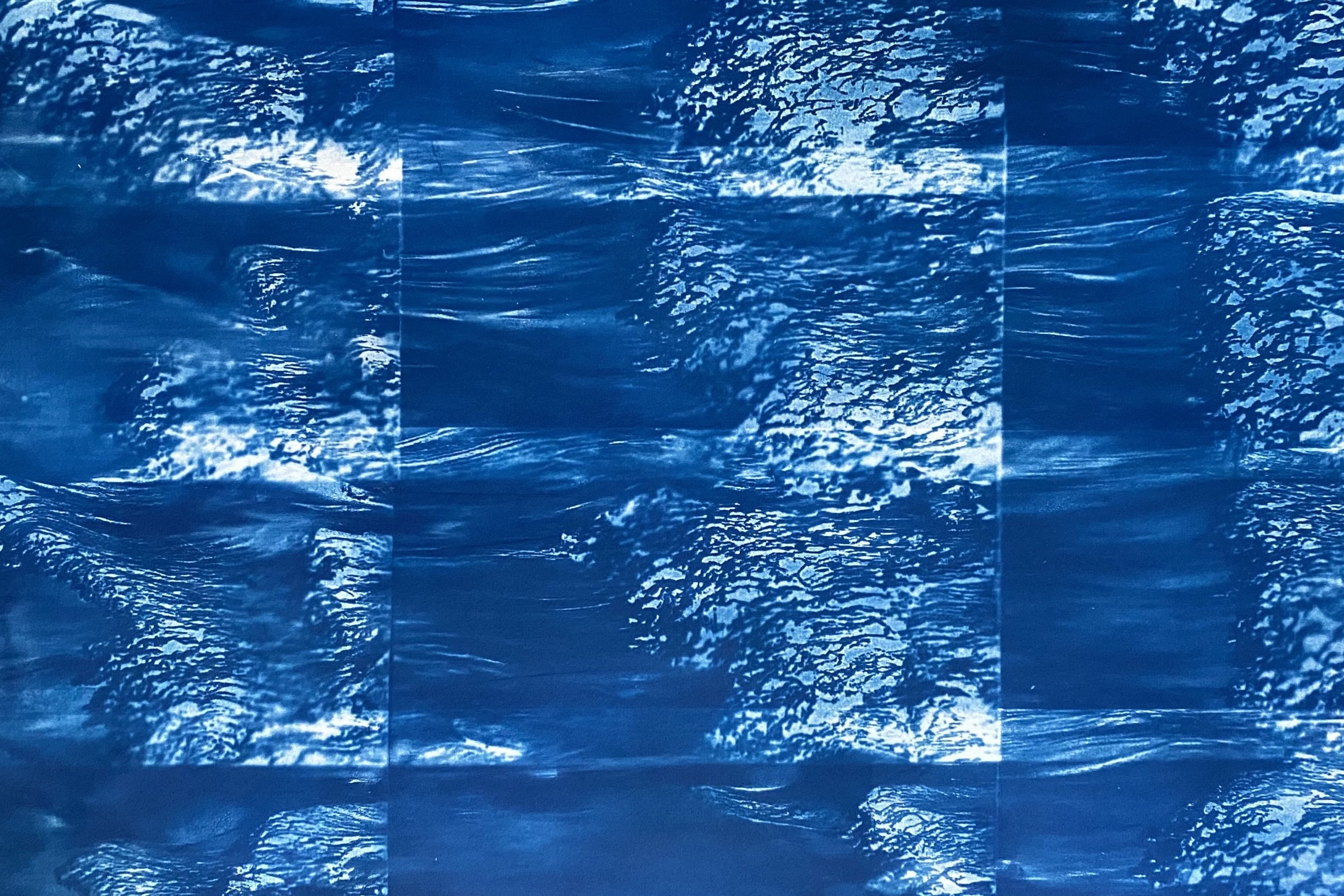 the image is of several waves overpinted, layered, collectively giving a sense of a powerful arrival of an incoming tide, one that pushes the Severn back inland